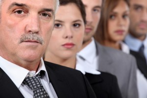 Head and shoulder shot of five serious co-workers